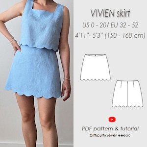 May include: A light blue two-piece outfit, comprising a crop top and a mini skirt with a scalloped hem. The outfit is displayed on a person. Text on the image reads "VIVIEN skirt" and "US 0-20/ EU 32 - 52" and "4'11"-5'3" (150-160 cm)".