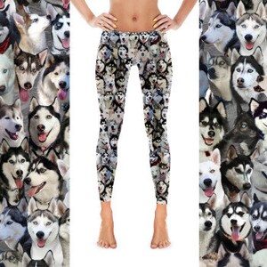 May include: Black leggings with a repeating pattern of Siberian Husky dog faces. The dogs are all different colors and have different expressions.