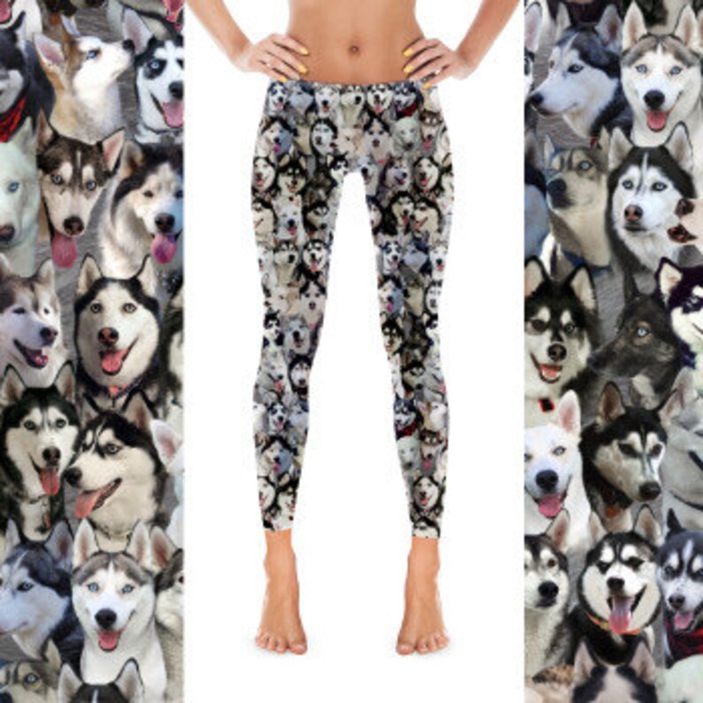 May include: Black leggings with a repeating pattern of Siberian Husky dog faces. The dogs are all different colors and have different expressions.