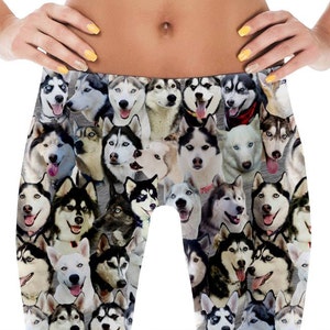 May include: Black and white leggings with a pattern of many husky dog faces.