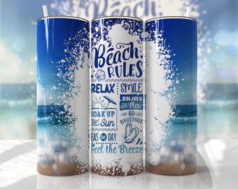 May include: A white tumbler with a blue and white beach scene and the text "Beach Rules: Relax, Smile, Enjoy the View, Soak Up the Sun, Go Barefoot, Seas the Day, Feel the Breeze".