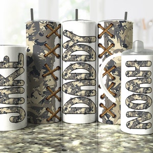 May include: Set of three stainless steel tumblers with a camouflage pattern and the names "Jake", "Daddy", and "Noah" printed on them. The tumblers have a brown rope design and are ideal for everyday use.
