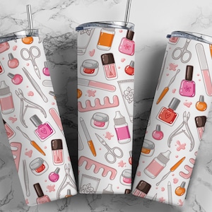 May include: Three stainless steel tumblers with a white background and a repeating pattern of nail polish bottles, nail clippers, nail files, and other manicure tools.