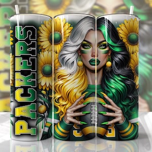 May include: A green and white tumbler with a graphic of a woman with green and blonde hair holding a football. The tumbler has the word "PACKERS" written on it.