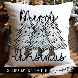 May include: White pillow with the text "Merry Christmas" in black script. Three stylized green and white trees are behind the text. The pillow is for sublimation or DTF printing.