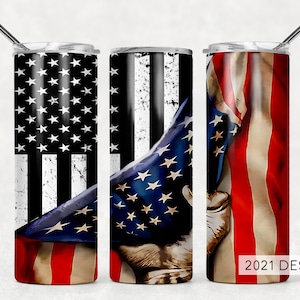 May include: Three stainless steel tumblers with a patriotic design. Each tumbler features a different variation of the American flag, with red, white, and blue colors. The tumblers are perfect for keeping drinks cold or hot.
