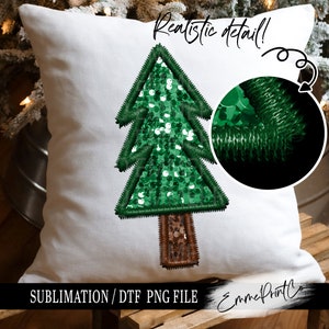 May include: A white pillow with a green sequined Christmas tree design. The text "Realistic detail!" and "Sublimation/ DTF PNG File" are printed on the pillow. The pillow is on a wooden surface.