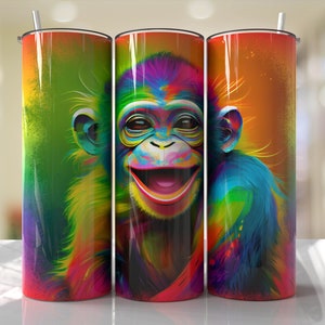 May include: A colorful, abstract design of a monkey's face on a stainless steel tumbler. The monkey has a bright, colorful, rainbow-like fur pattern. The tumbler is a great way to keep your drinks cold or hot.