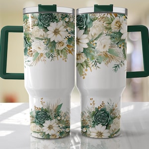 May include: Two white stainless steel travel mugs with green lids and handles. The mugs feature a floral design with white flowers, green leaves, and gold accents.