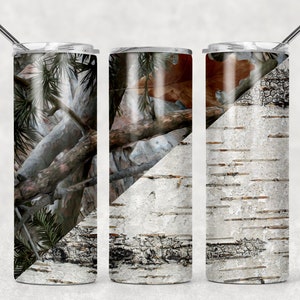 May include: Three stainless steel insulated tumblers with lids and straws. The tumblers feature a camouflage design, a tree branch design, and a birch bark design. The tumblers are cylindrical and have a silver rim and straw.