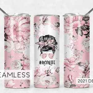 May include: A pink and white stainless steel tumbler with a floral design and the text "#MOMLIFE".