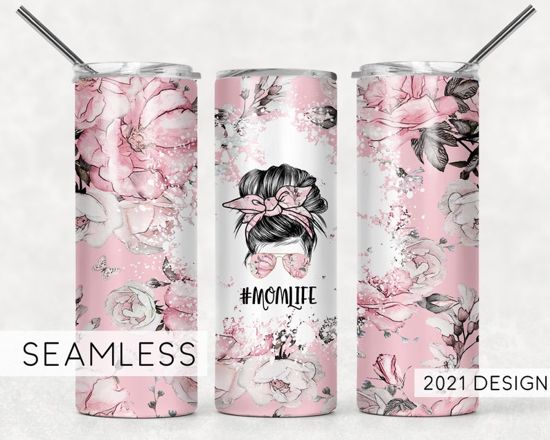 May include: A pink and white stainless steel tumbler with a floral design and the text "#MOMLIFE".