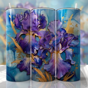 May include: Three stainless steel tumblers with a design of purple iris flowers with gold accents on a blue background.
