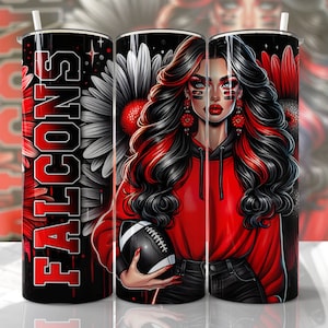 May include: A red and black stainless steel tumbler with a graphic of a woman with red and black hair holding a football. The tumbler has the word "FALCONS" written vertically on the side.