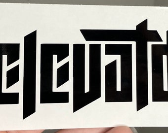 May include: Black vinyl sticker with the word "elevated" in a bold, stylized font.