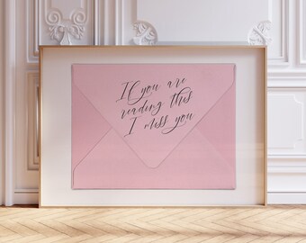 May include: A framed pink envelope with the text "If you are reading this I miss you" written in black calligraphy.