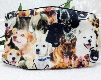May include: A white face mask with a colorful pattern of various dog breeds. The mask has black elastic straps.