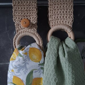 a pair of crocheted bags sitting on top of a table