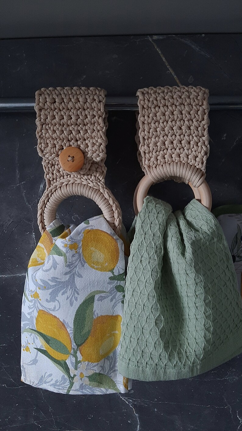 a pair of crocheted bags sitting on top of a table