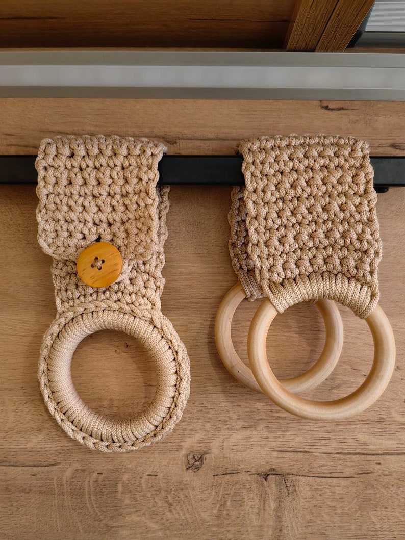 a pair of wooden rings hanging from a wall