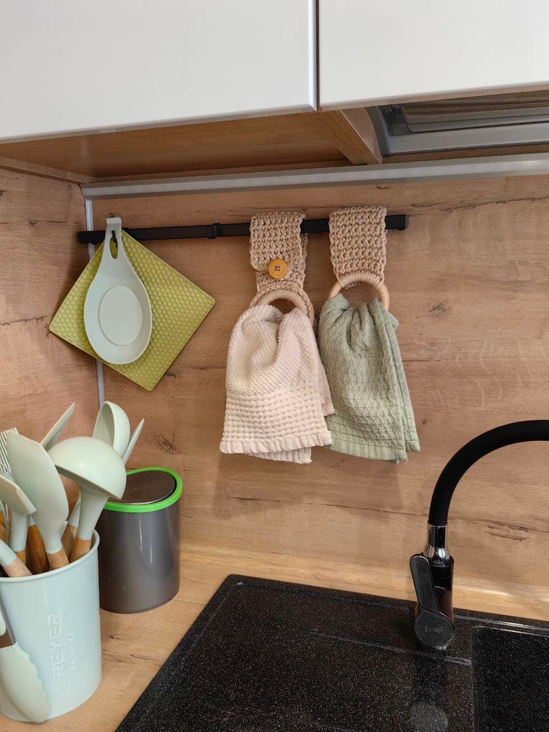 kitchen utensils hanging on a wooden wall