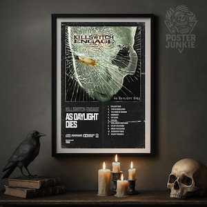 May include: Framed poster for the band Killswitch Engage, titled "As Daylight Dies." The artwork features a cracked glass effect over a skull image. The poster is displayed with candles, a raven statue, and a skull.