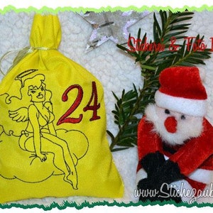 May include: A yellow fabric bag with a number 24 embroidered on it. The bag features an embroidered image of an angel with a halo sitting on a cloud. The bag is decorated with a white ribbon. The text "Stickerei & Foto Irene" is visible in the background.