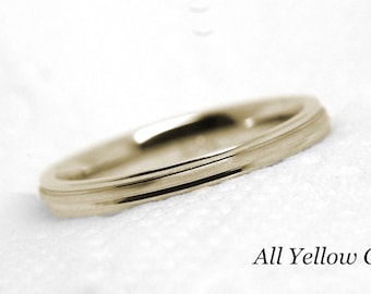 May include: A simple gold wedding band with a subtle grooved design. All Yellow Gold.