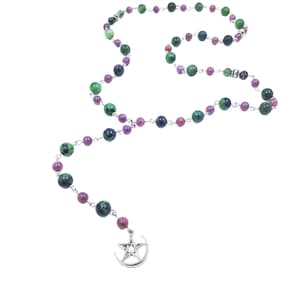 May include: A beaded necklace featuring a variety of colorful gemstones. The necklace has a silver-toned chain and a pendant with a crescent moon and a star. The beads are in shades of green, purple, and pink.
