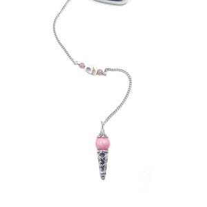May include: A silver pendulum with a teardrop-shaped top filled with clear beads. A chain connects to pink beads and a pink sphere pendant with a decorative silver cone. The design is set against a white background.