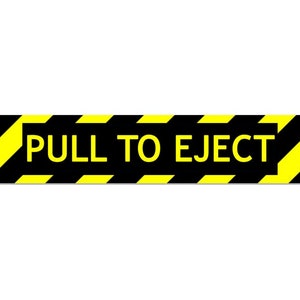 May include: Black and yellow striped warning sign with the text "PULL TO EJECT" in yellow letters.