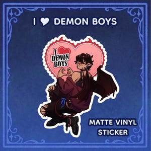 May include: A matte vinyl sticker featuring a cartoon demon boy with red wings and a heart-shaped speech bubble that says "I love demon boys".