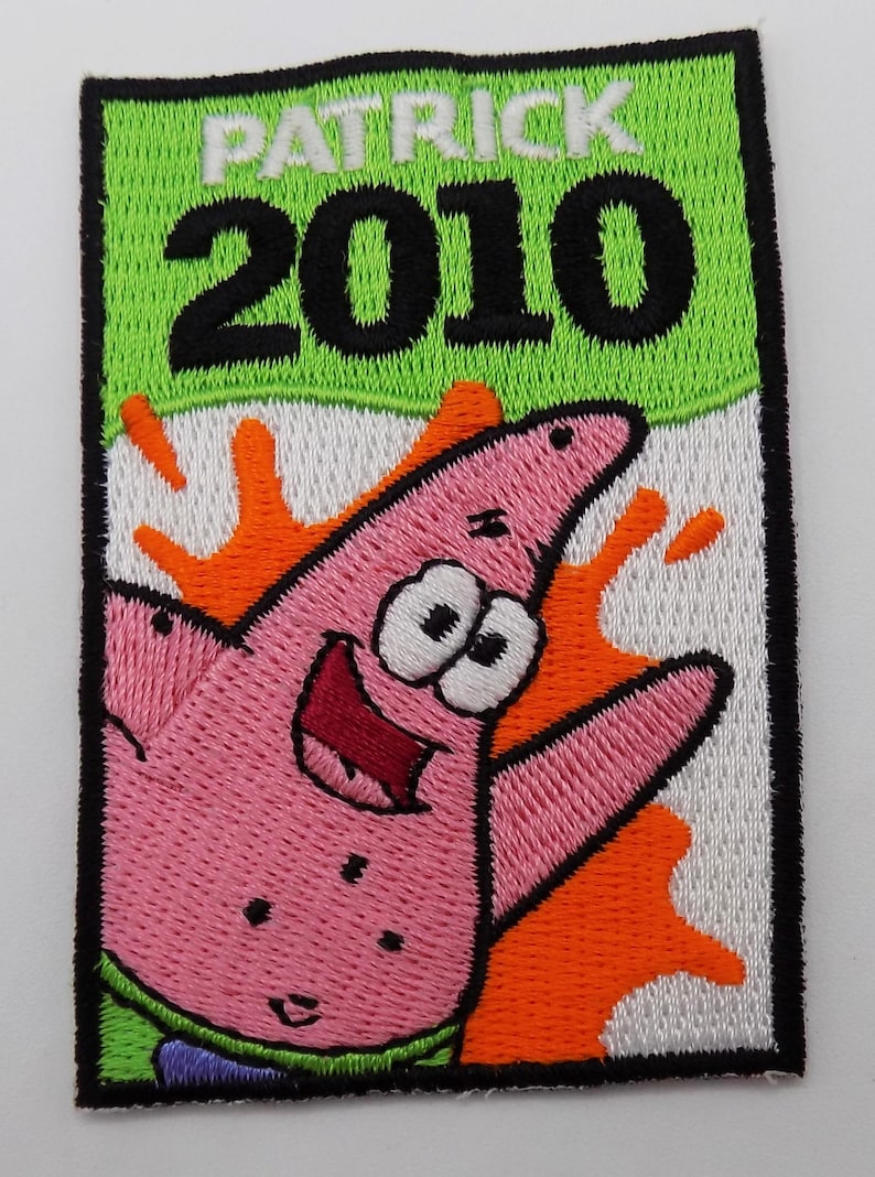 May include: Embroidered patch featuring Patrick Star from Spongebob Squarepants. The patch has a green background with the name "PATRICK" and the year "2010" in black. Patrick is pink with an orange splash.