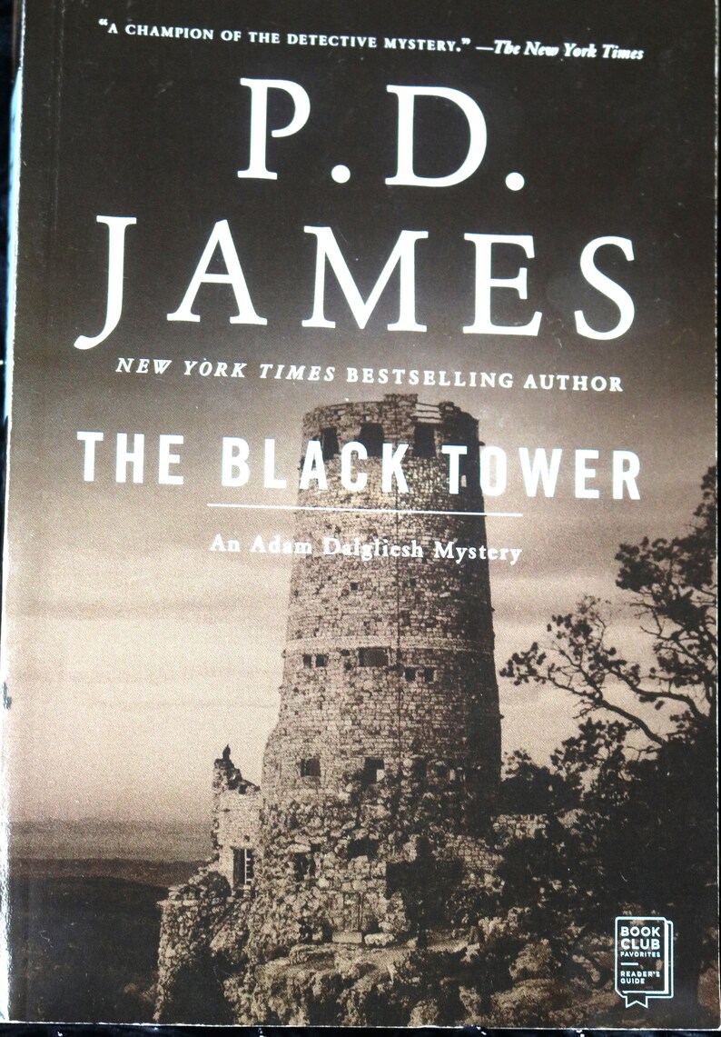 May include: Book cover for "The Black Tower" by P.D. James, a New York Times bestselling author. The cover features a black and white photo of a stone tower against a cloudy sky. The text "An Adam Dalgliesh Mystery" is printed below the title.