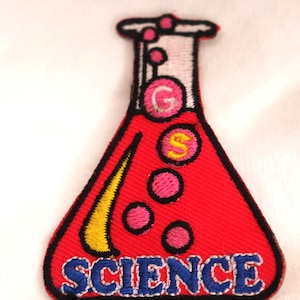 May include: Red embroidered iron-on patch shaped like a beaker with the word "SCIENCE" in blue lettering and yellow and pink details.