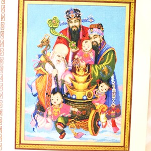 May include: Cross-stitch pattern titled "Hok Lok Siew" featuring a detailed illustration of several figures, including three men with long beards and children. The design includes gold accents and is set against a light blue background.