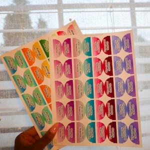 May include: Three sheets of colorful stickers with a gradient design. Each sticker has a rounded shape and features the text "strongly disagree" and "strongly agree" in white lettering.
