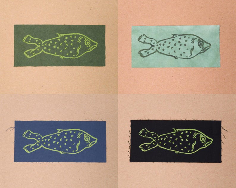 Fish patches in the colours Forest, Sea Green, Blue, and Black.