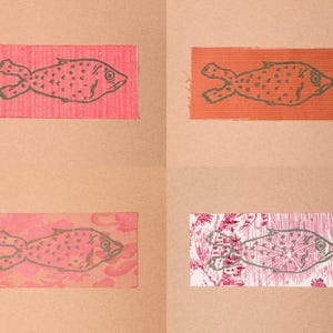 Fish patches in the colours Red/White, Corduroy, Pink Floral, and Red/White Drawing.