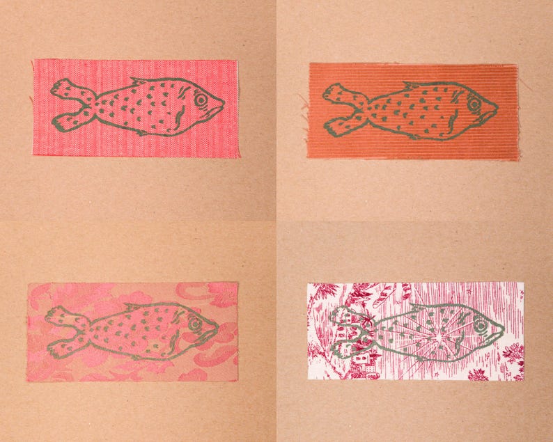 Fish patches in the colours Red/White, Corduroy, Pink Floral, and Red/White Drawing.
