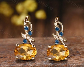 Pendientes ovalados de citrino, oro rosa, topacio azul de Londres, joyería inspirada en la naturaleza.