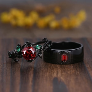 Anillo de compromiso gótico con granate rojo: banda de pan de oro negro