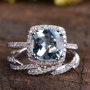 Anello di fidanzamento con acquamarina, fascia di diamanti intrecciati, oro bianco 14k