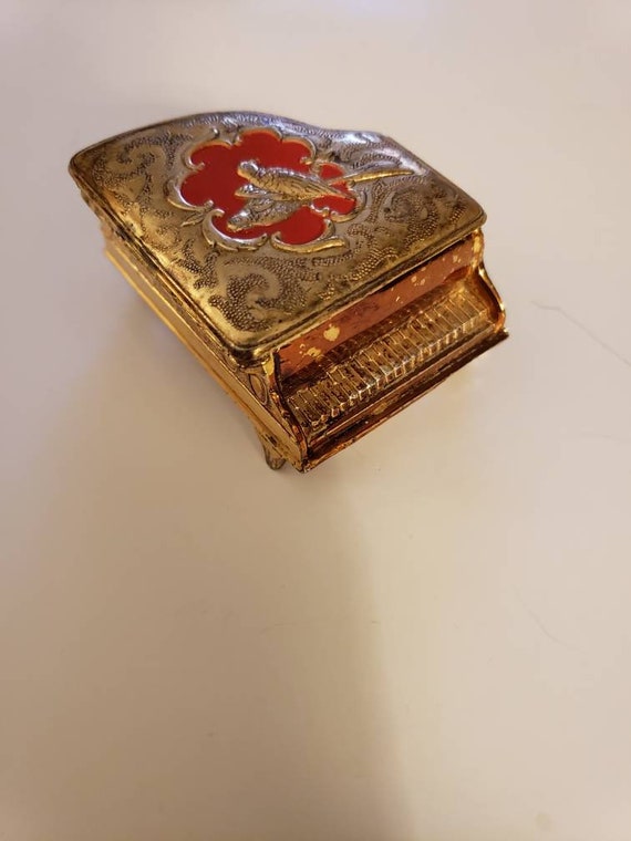 Red and gold piano trinket box