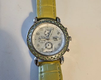 Ladies Vivani Stylish Round Silver Tone green leather band Analog Watch
