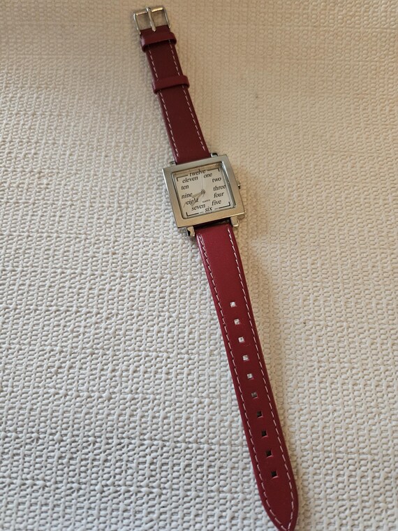 ladies red watch with handwritten numbers - image 3