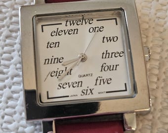ladies red watch with handwritten numbers
