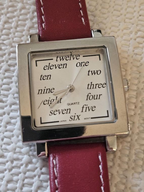 ladies red watch with handwritten numbers - image 1