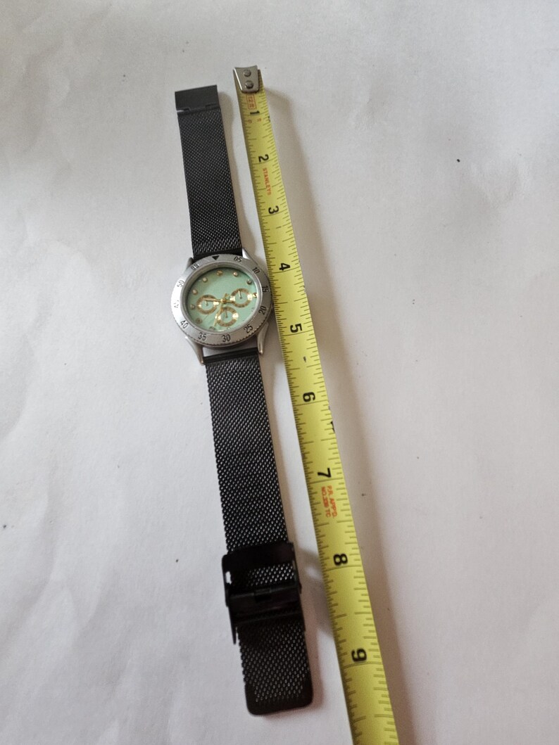 Ladies green face watch with new battery image 4