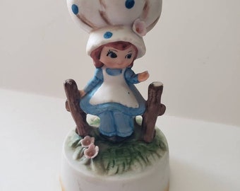 Lefton porcelain figurine plays Oh what a beautiful morning